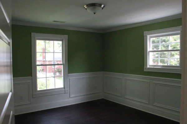 Single crown molding and wainscoting in a secondary bedroom