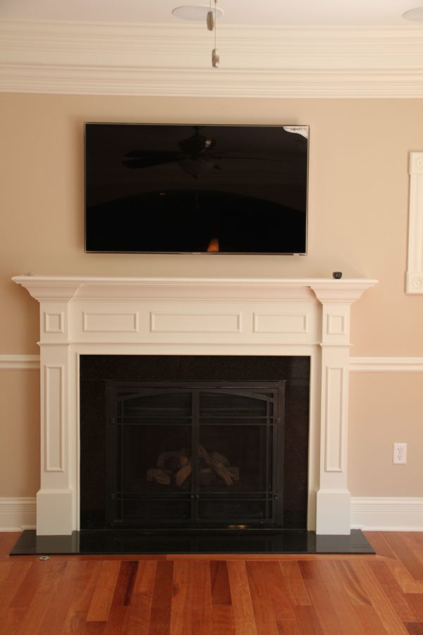 Custom Mantle with chair rail on either side