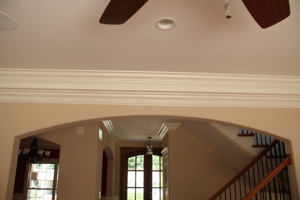 Arched opening with crown molding running above the arch